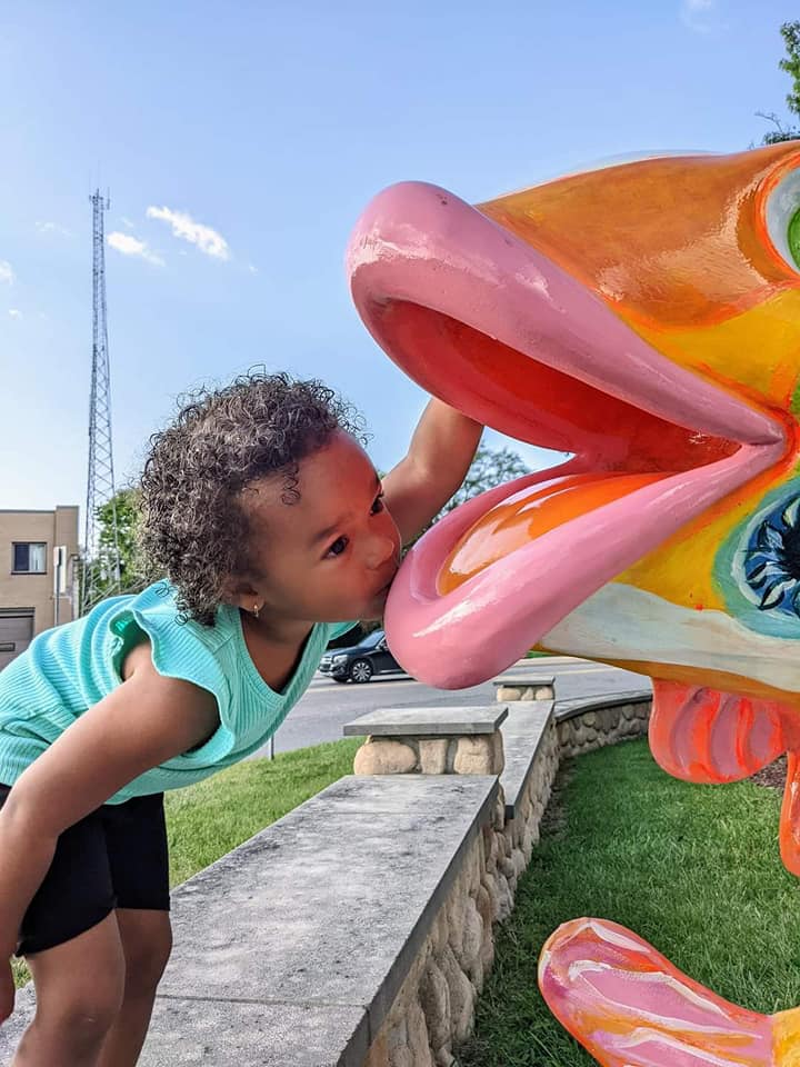 pic of Janelle kissing the fish at Victory Park
